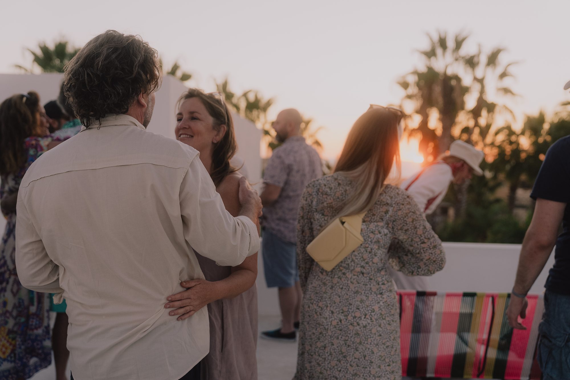 Chris and Anne together at sunset on the rooftop at Casa del Arte, among friends